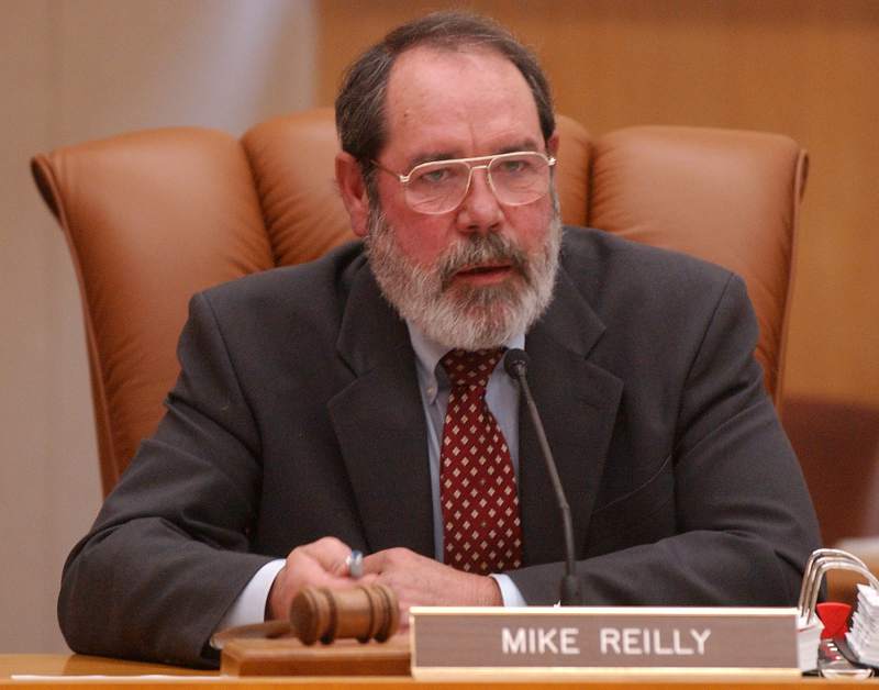 Mike Reilly Sitting At His Desk