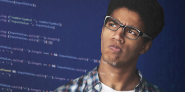 black teen looking at code