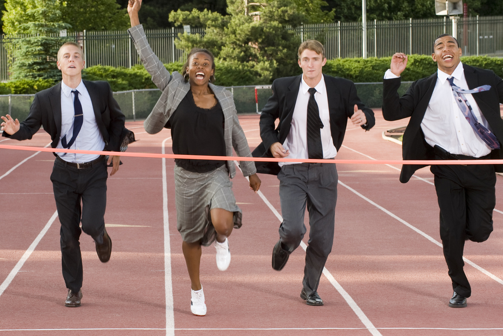 Business Finish Line suited folks running to the finish line