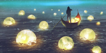 man rowing through glowing balls