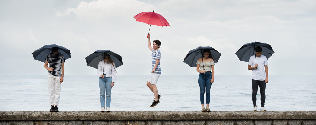 youth with umbrellas