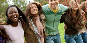 group of diverse, smiling teens